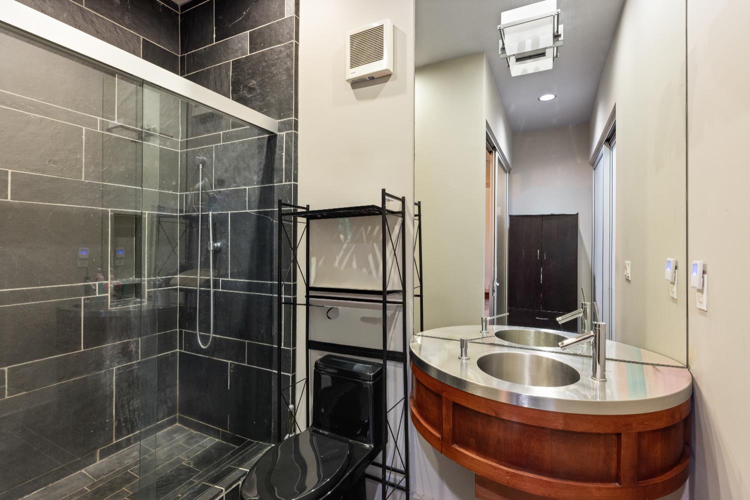 7434 River Nine Drive Modesto, CA 95356 - Photo 39 of 56 a bathroom with a sink and mirror