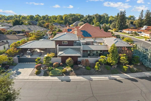 an aerial view of a residential apartment building with a yard