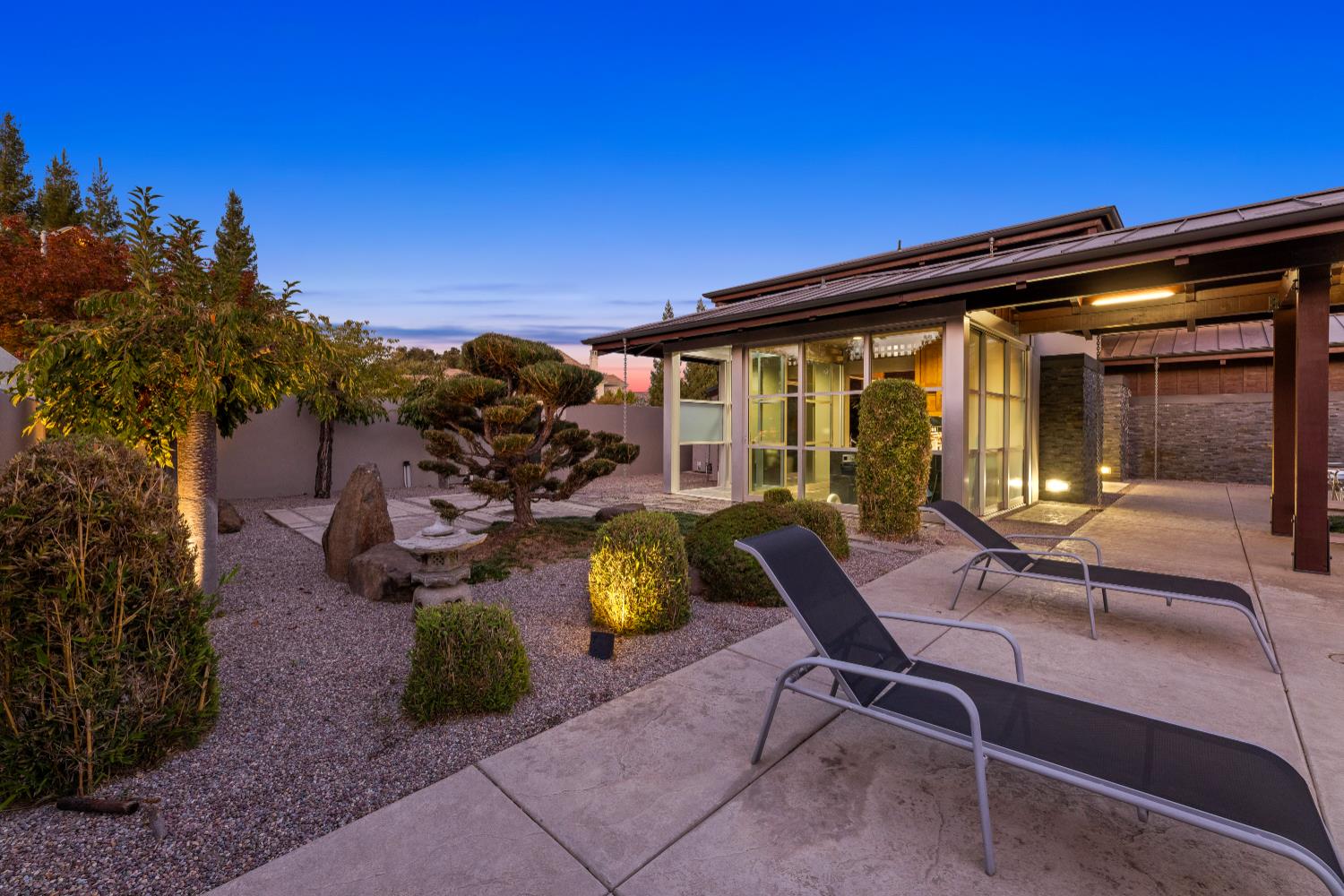 7434 River Nine Drive Modesto, CA 95356 - Photo 49 of 56 a view of a patio with a table and chairs under an umbrella