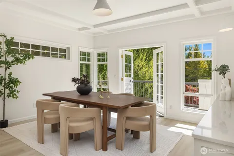 a view of a dining room with furniture and window