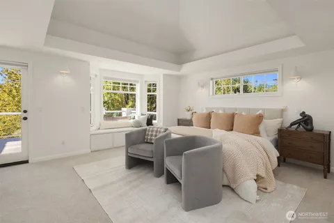 a spacious bedroom with a bed and a window