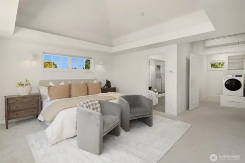 a spacious bedroom with a bed and cabinets