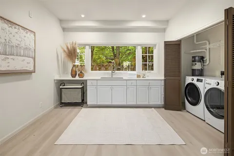 a view of a kitchen with washer and dryer
