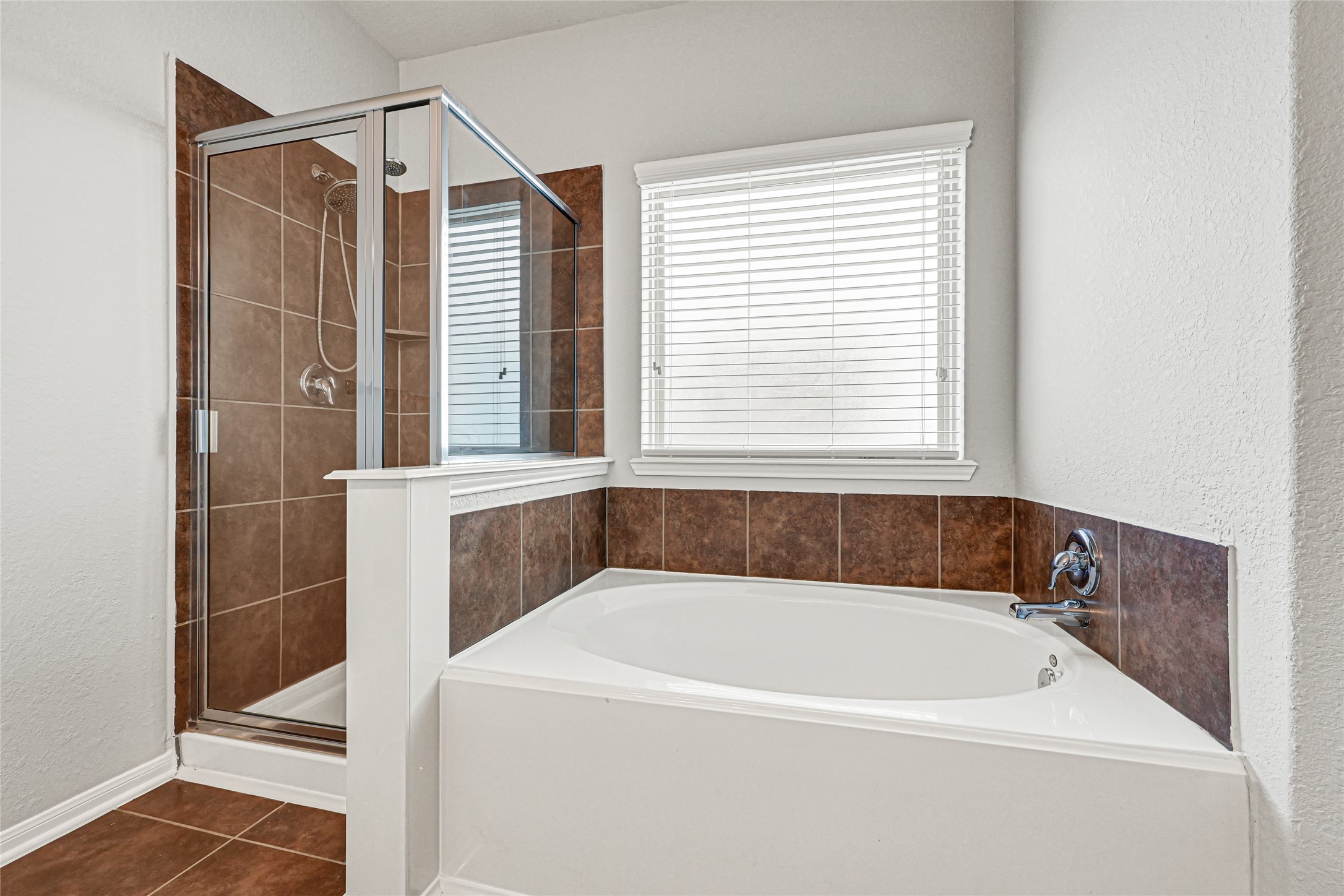 5331 Seabird Street Baytown, TX 77521 - Photo 24 of 38 a bathroom with a bathtub and a shower