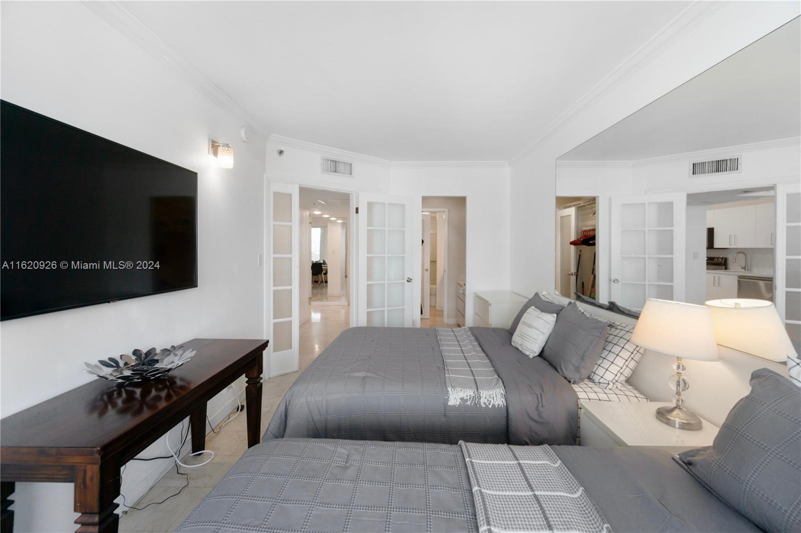 100 Lincoln Road, Unit 820 Miami Beach, FL 33139 - Photo 6 of 20 a living room with furniture and a flat screen tv