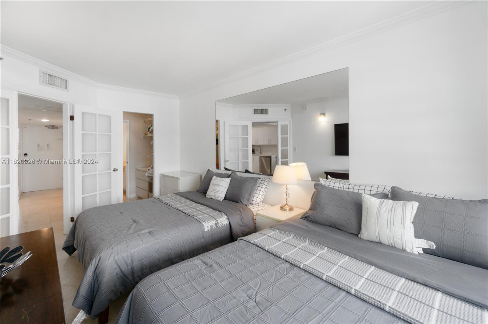 100 Lincoln Road, Unit 820 Miami Beach, FL 33139 - Photo 8 of 20 a bedroom with a bed and a couch