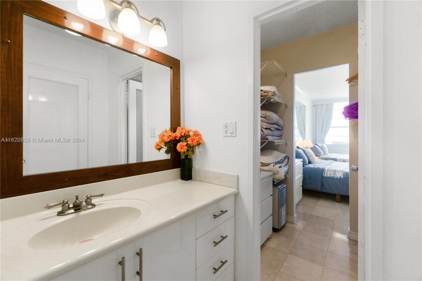100 Lincoln Road, Unit 820 Miami Beach, FL 33139 - Photo 10 of 20 a bathroom with a sink double vanity and a mirror
