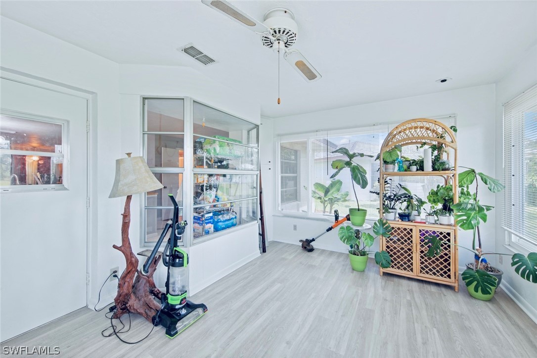 1604 Ridgecrest Street Lehigh Acres, FL 33936 - Photo 20 of 26 a view of a room with gym equipment