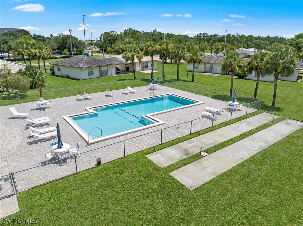 1604 Ridgecrest Street Lehigh Acres, FL 33936 - Photo 4 of 26 a view of a backyard with a garden and trees