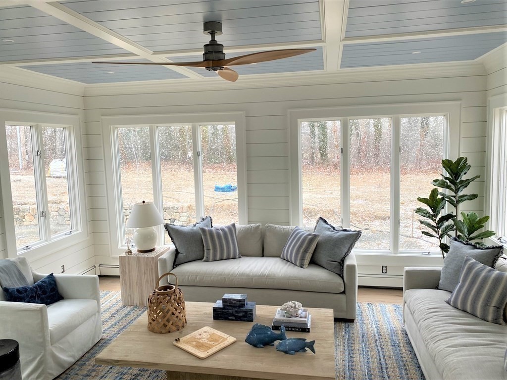 219 Training Field Road Chatham, MA 02633 - Photo 12 of 24 a living room with furniture and floor to ceiling windows