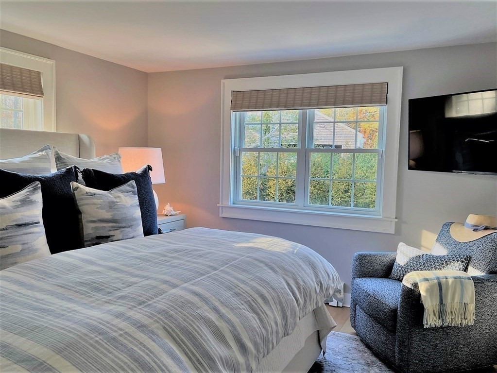 219 Training Field Road Chatham, MA 02633 - Photo 15 of 24 a bedroom with bed and a flat screen tv