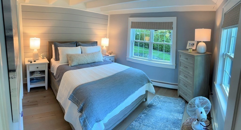 219 Training Field Road Chatham, MA 02633 - Photo 16 of 24 a bed room with a bed and a window