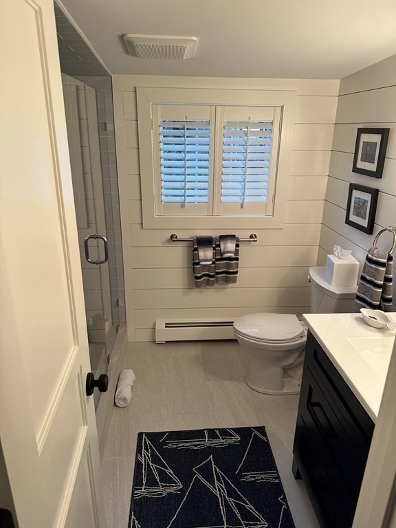 219 Training Field Road Chatham, MA 02633 - Photo 22 of 24 a bathroom with a sink a toilet a mirror and shower