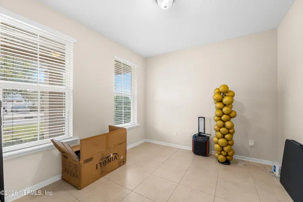 a bed room with a bed and gym equipment