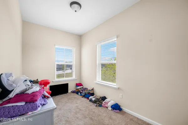 a bedroom with furniture and a bed