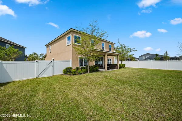 a front view of multiple houses with outdoor seating