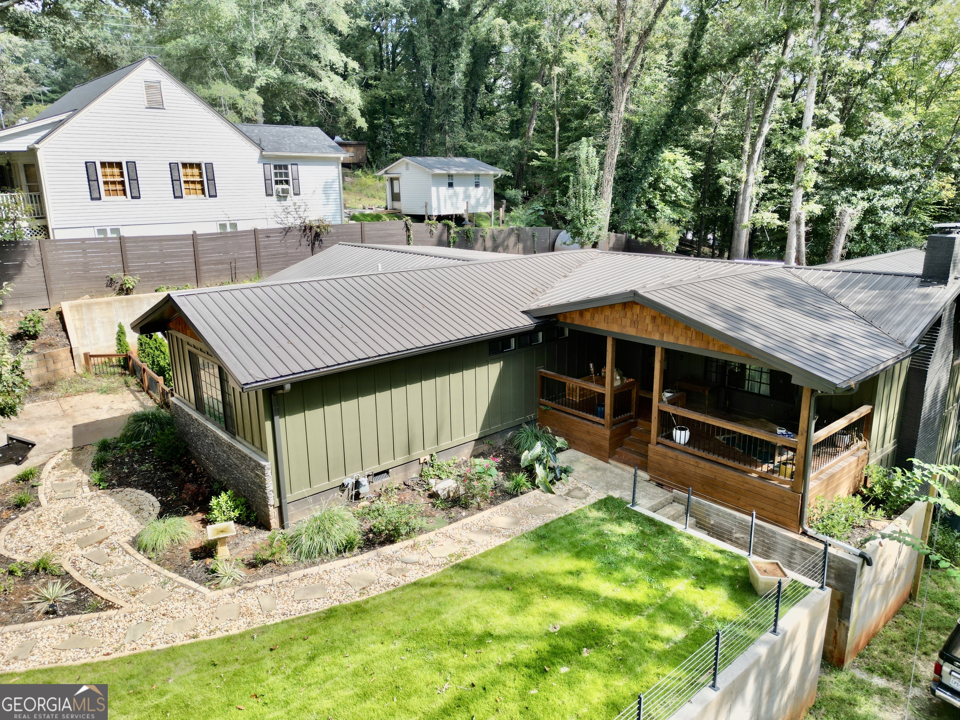 775 Ridgewood Avenue Gainesville, GA 30501 - Photo 1 of 77 a aerial view of a house with table and chairs in a patio