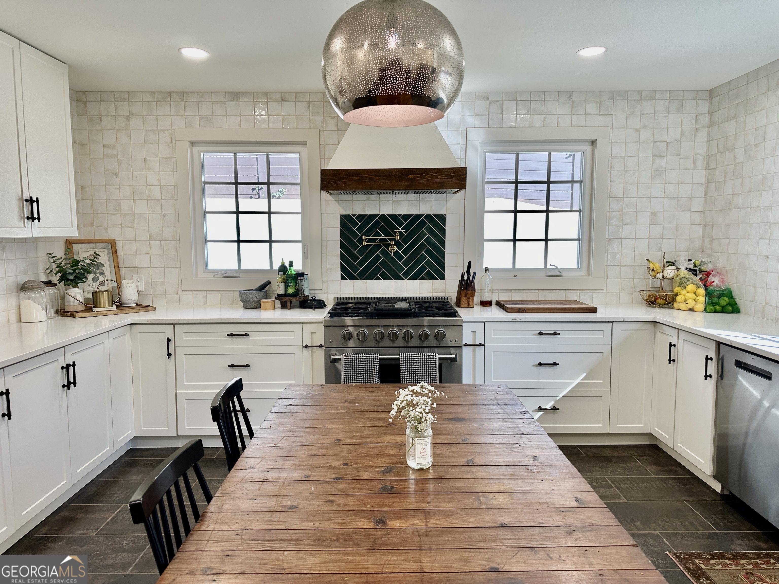 775 Ridgewood Avenue Gainesville, GA 30501 - Photo 11 of 77 a kitchen with stainless steel appliances a stove a sink and a refrigerator