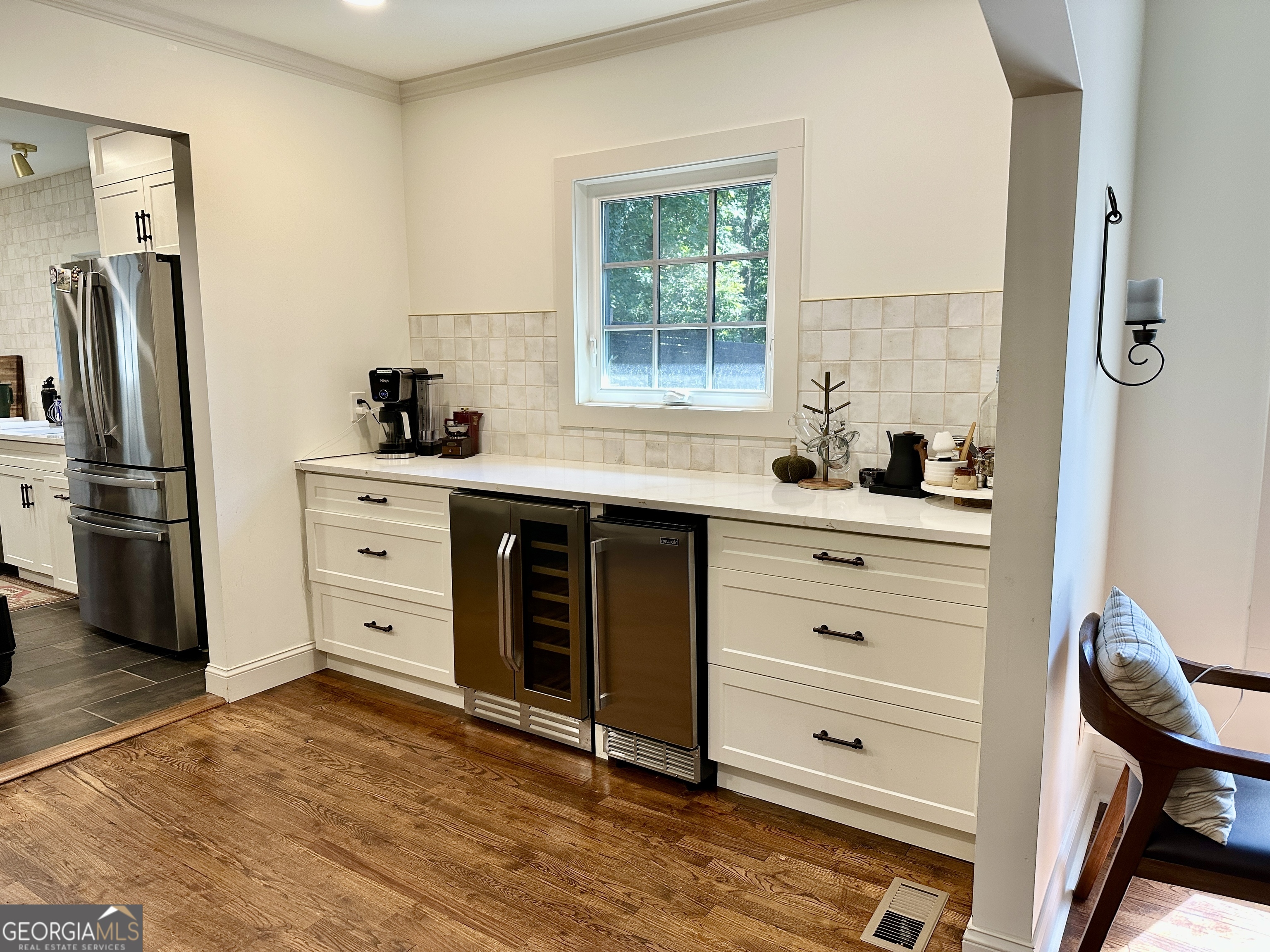 775 Ridgewood Avenue Gainesville, GA 30501 - Photo 13 of 77 a kitchen with stainless steel appliances a stove a refrigerator and a sink with wooden floor