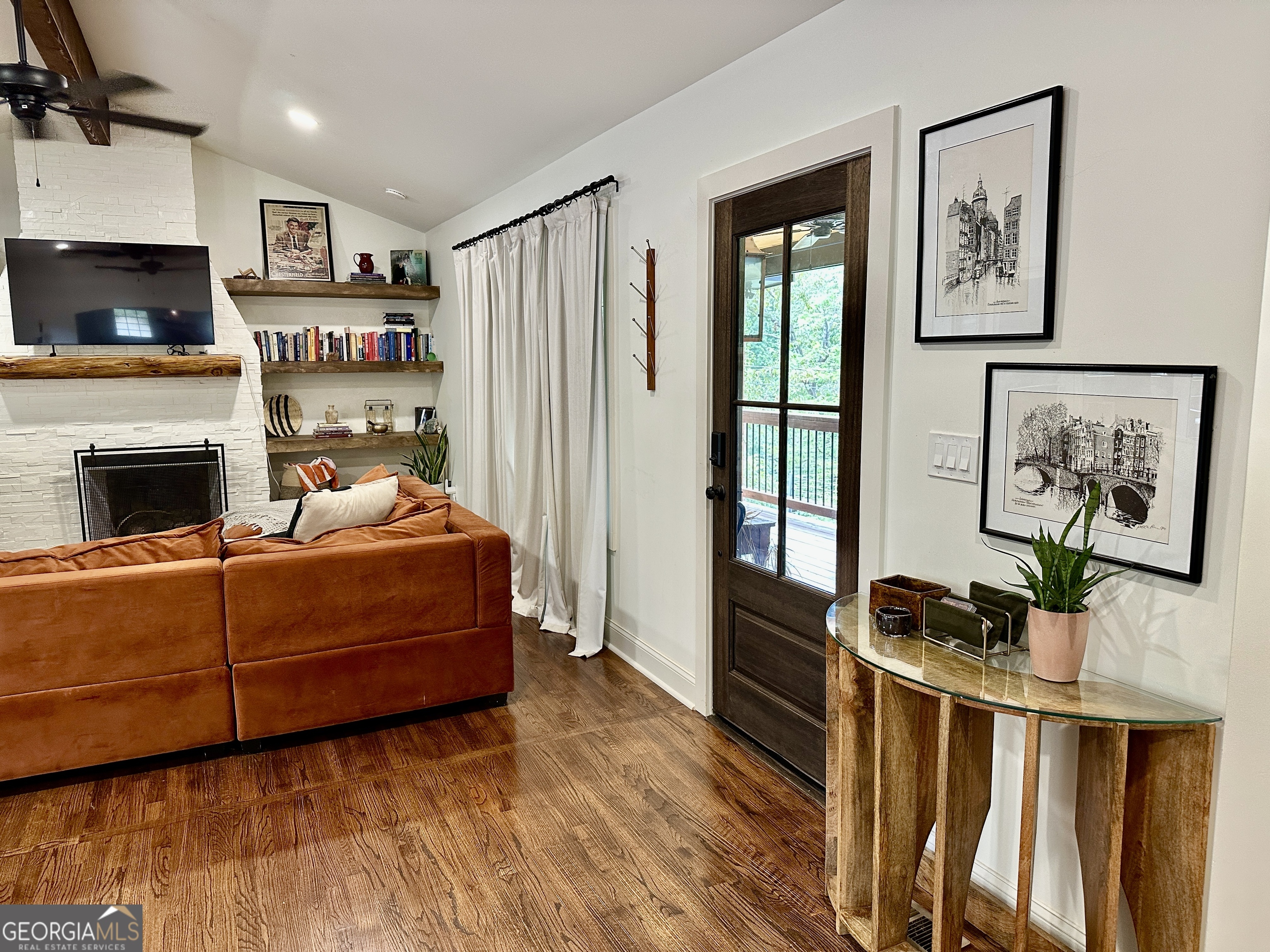 775 Ridgewood Avenue Gainesville, GA 30501 - Photo 20 of 77 a living room with furniture and a fireplace