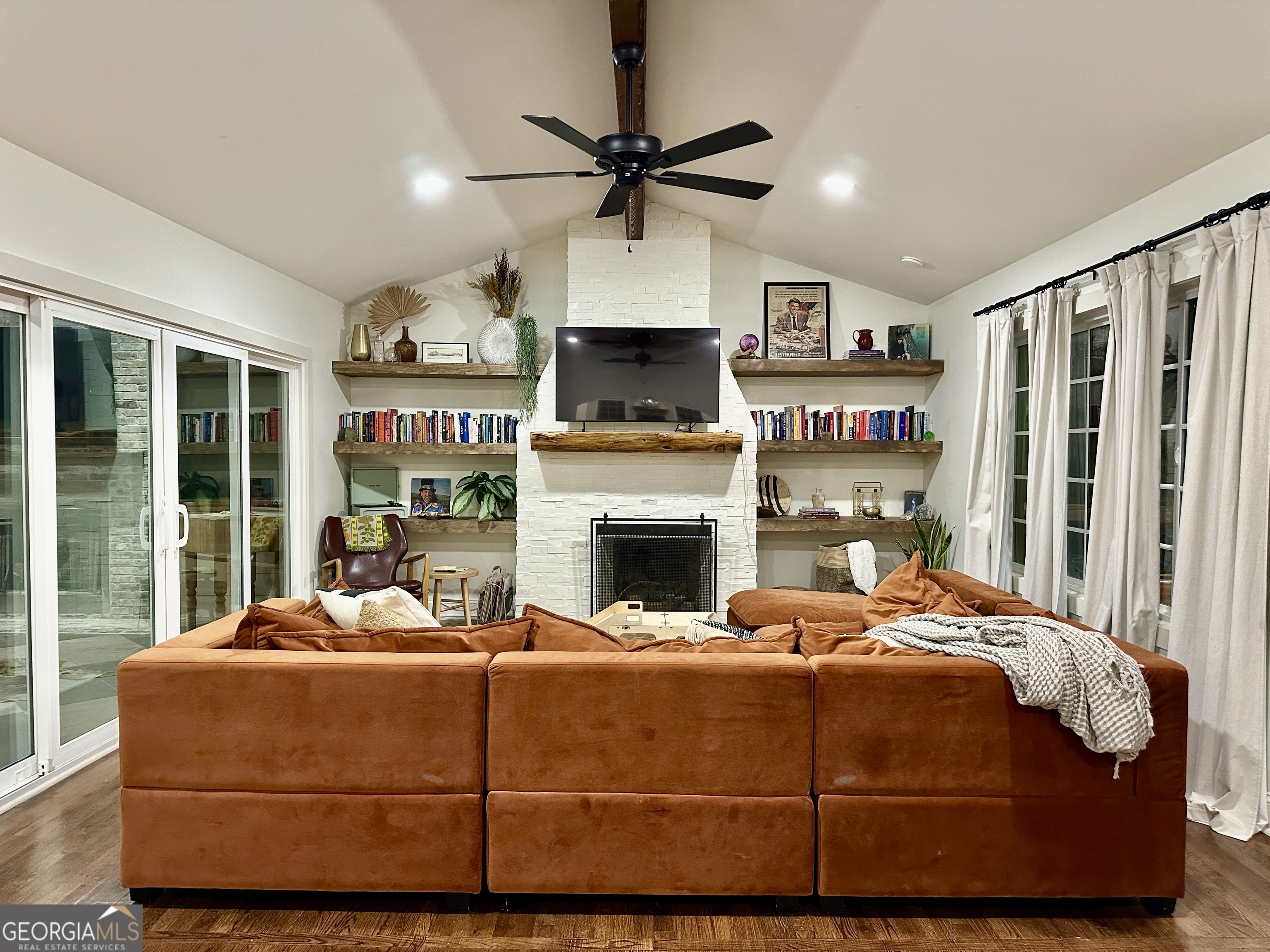 775 Ridgewood Avenue Gainesville, GA 30501 - Photo 21 of 77 a bedroom with a bed a fireplace and a large window