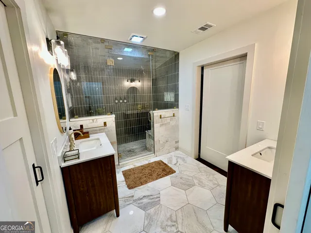 a bathroom with a sink toilet and shower