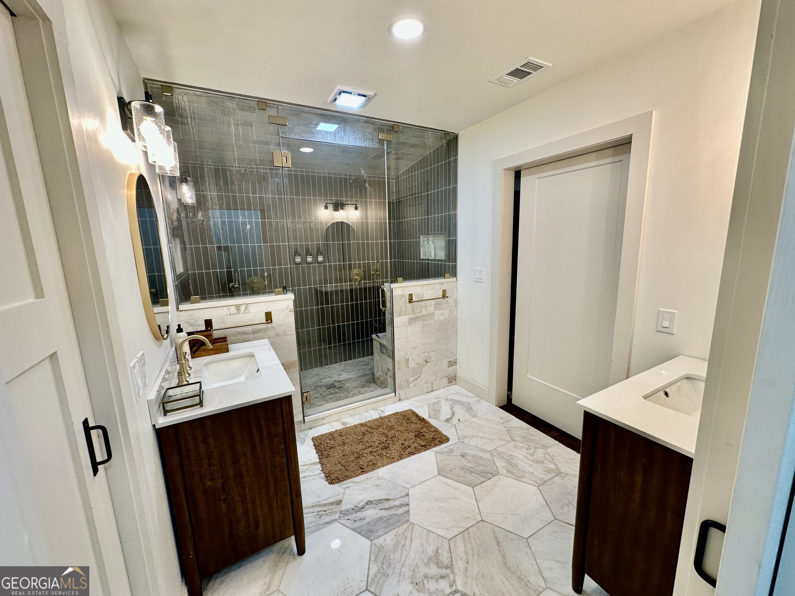 775 Ridgewood Avenue Gainesville, GA 30501 - Photo 27 of 77 a bathroom with a sink a toilet and shower