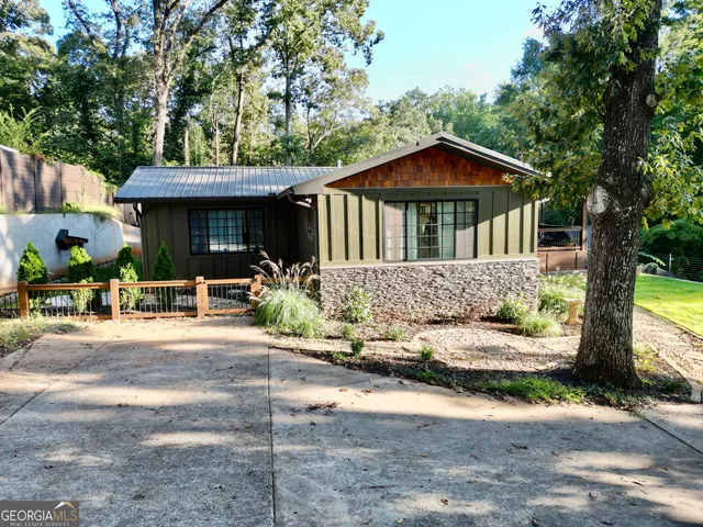a front view of a house with porch and livingroom