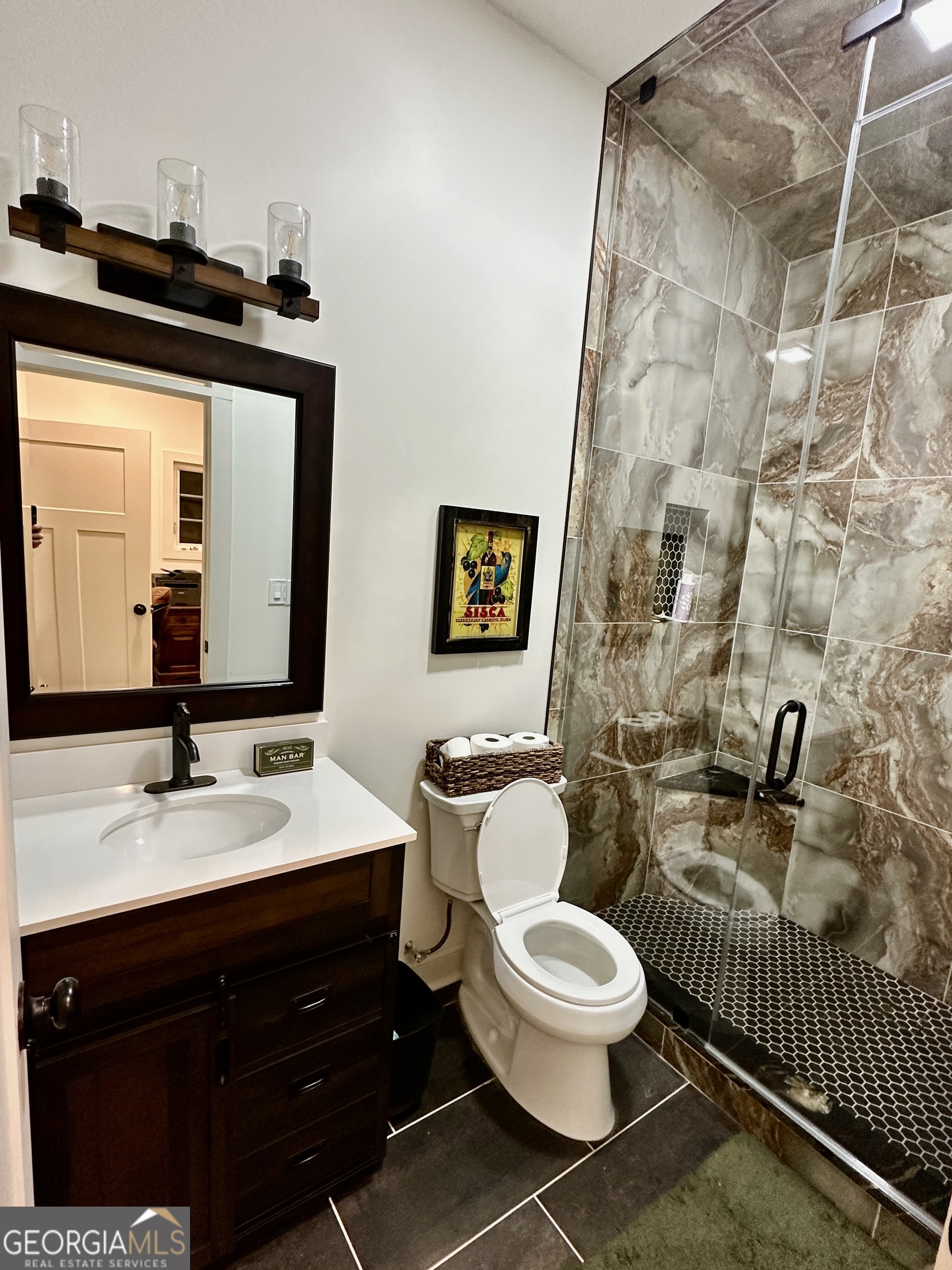 775 Ridgewood Avenue Gainesville, GA 30501 - Photo 31 of 77 a bathroom with a toilet sink and mirror