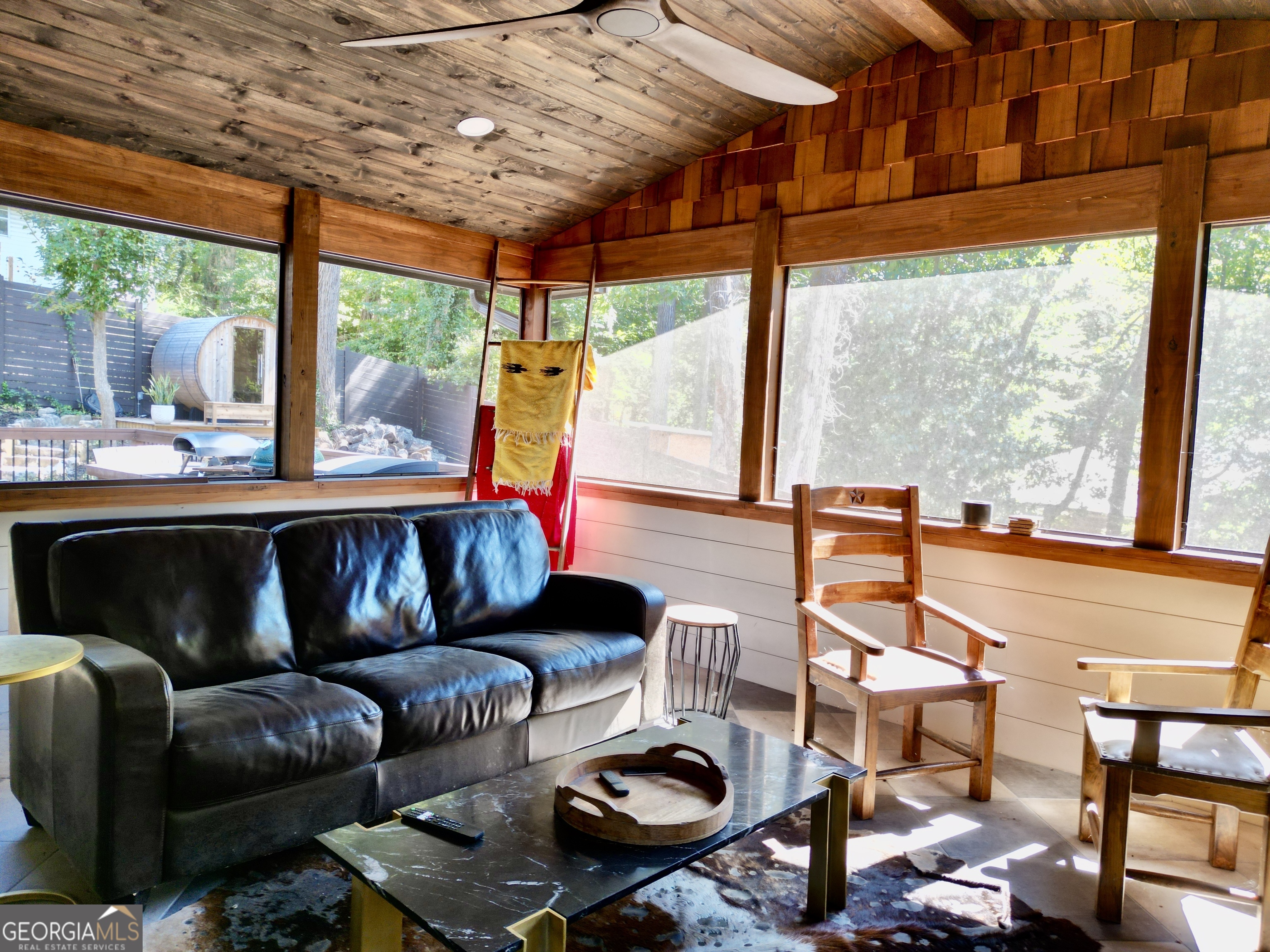 775 Ridgewood Avenue Gainesville, GA 30501 - Photo 47 of 77 a living room with furniture a table and chairs next to a window