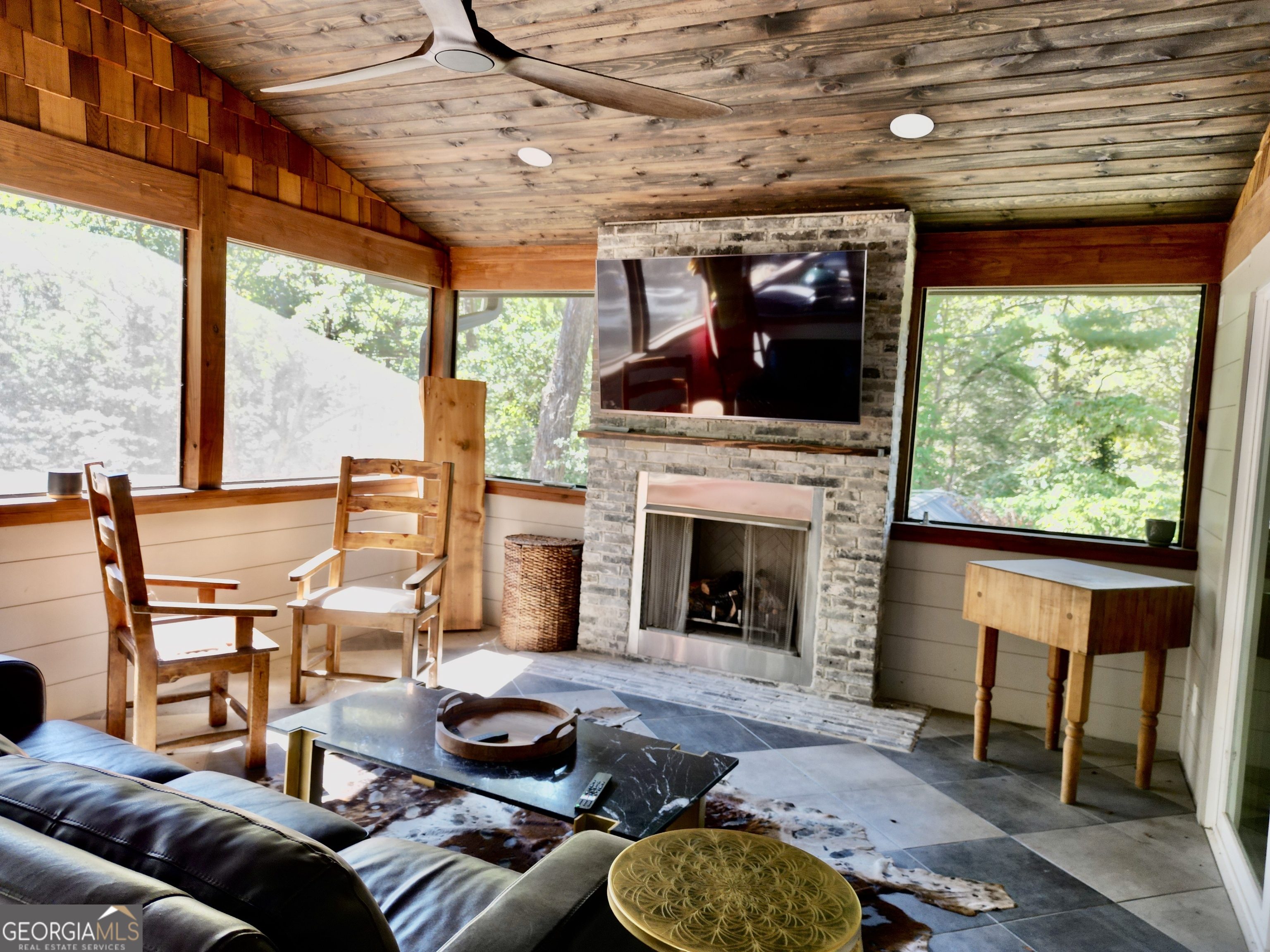 775 Ridgewood Avenue Gainesville, GA 30501 - Photo 48 of 77 a living room with furniture a fireplace and a table