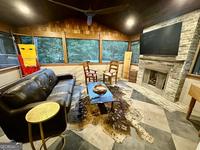 a view of a balcony with chair and wooden floor