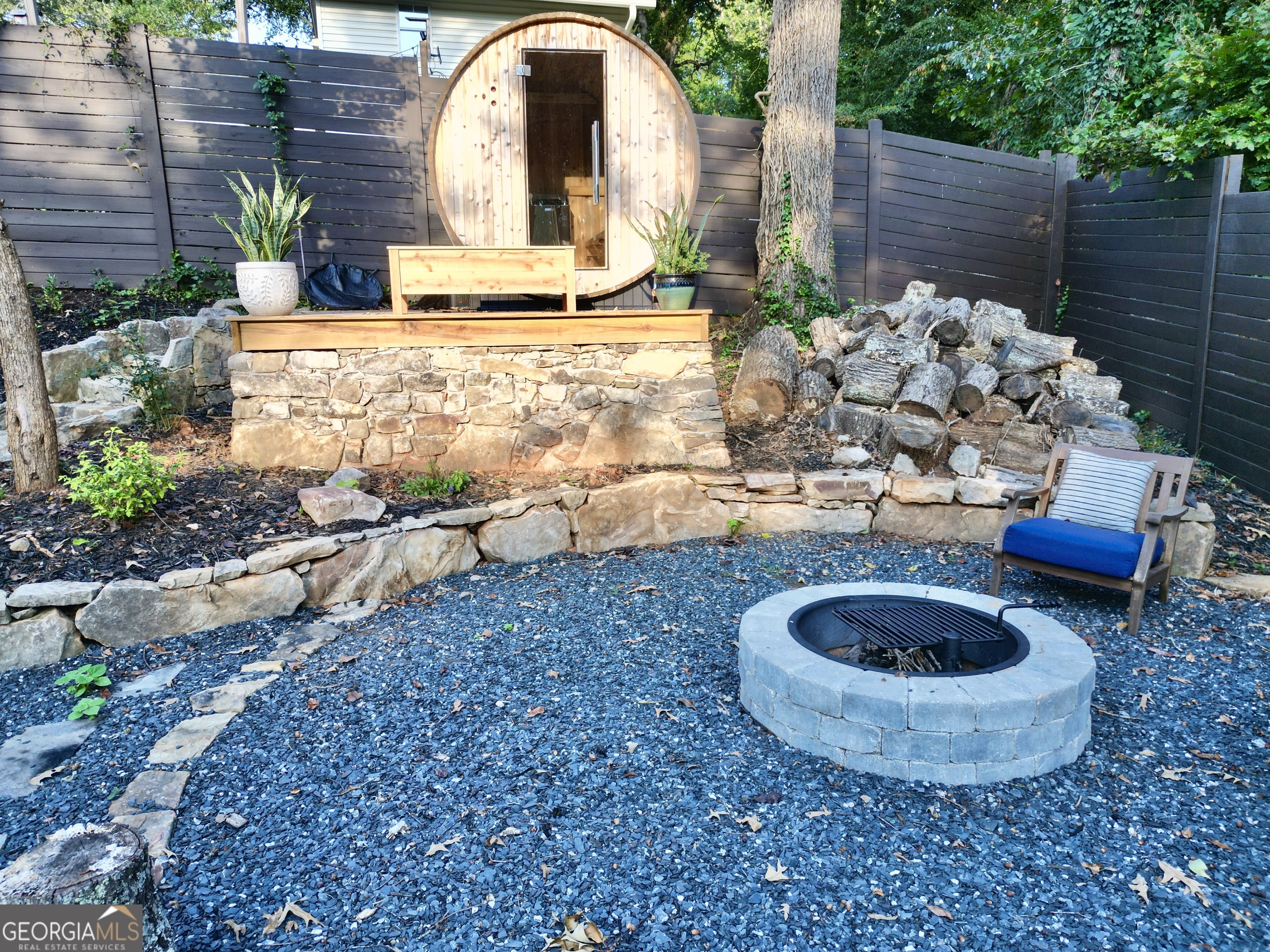 775 Ridgewood Avenue Gainesville, GA 30501 - Photo 60 of 77 a view of a backyard with plants and outdoor seating