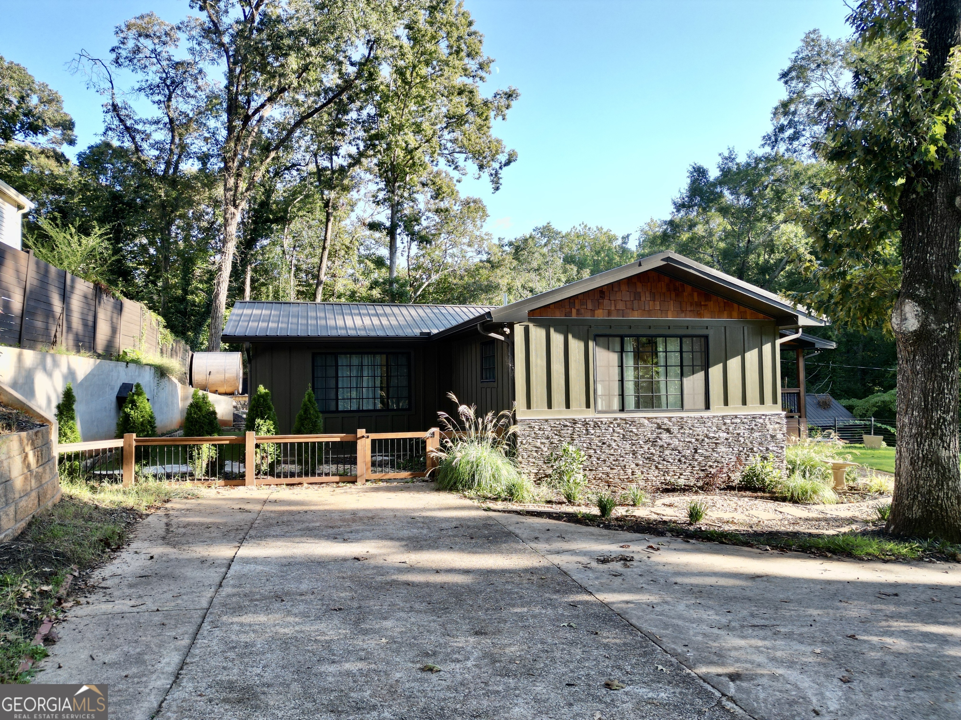 775 Ridgewood Avenue Gainesville, GA 30501 - Photo 6 of 77 a view of a house with a yard and sitting area