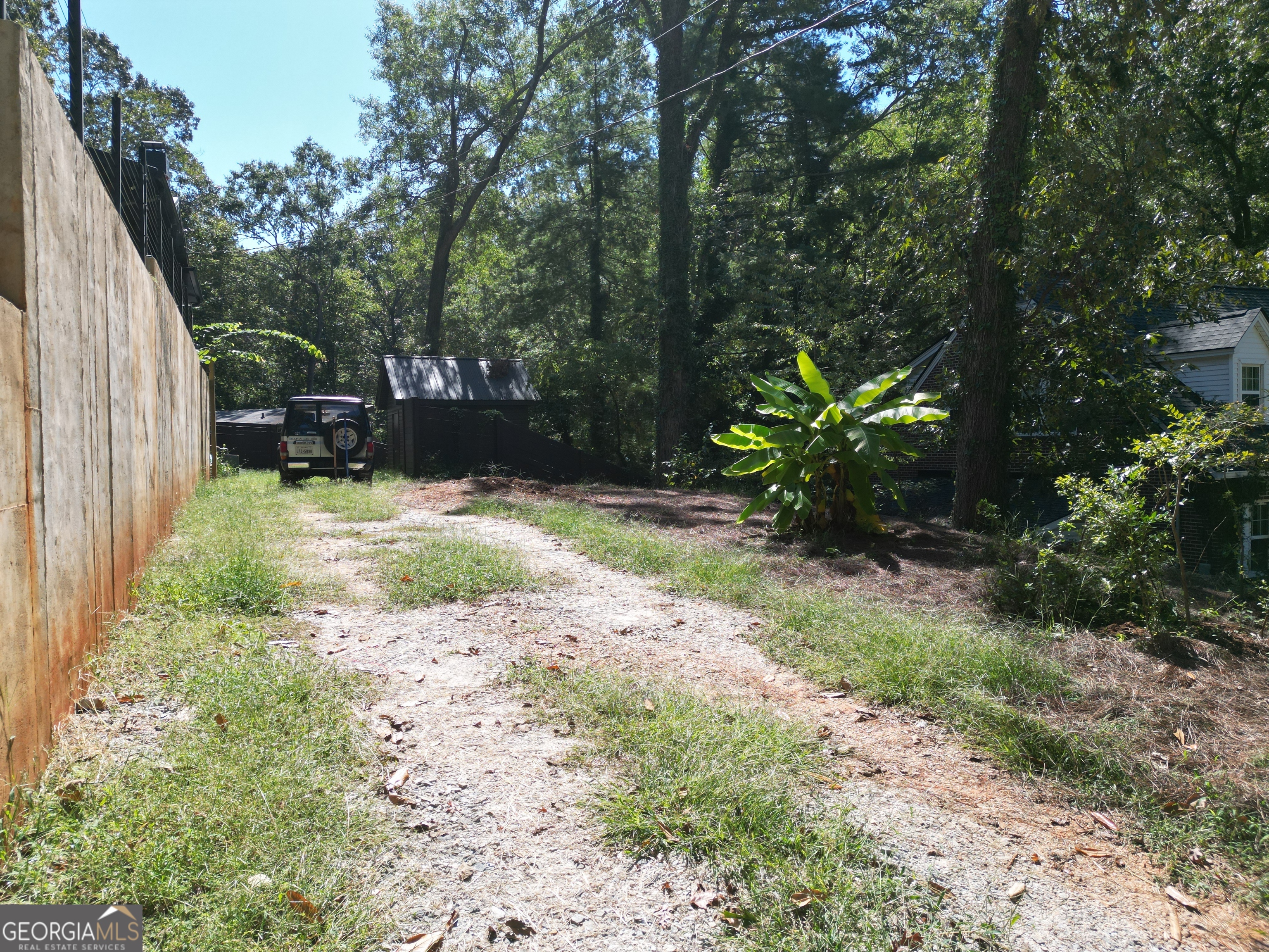 775 Ridgewood Avenue Gainesville, GA 30501 - Photo 69 of 77 a backyard of a house with lots of green space