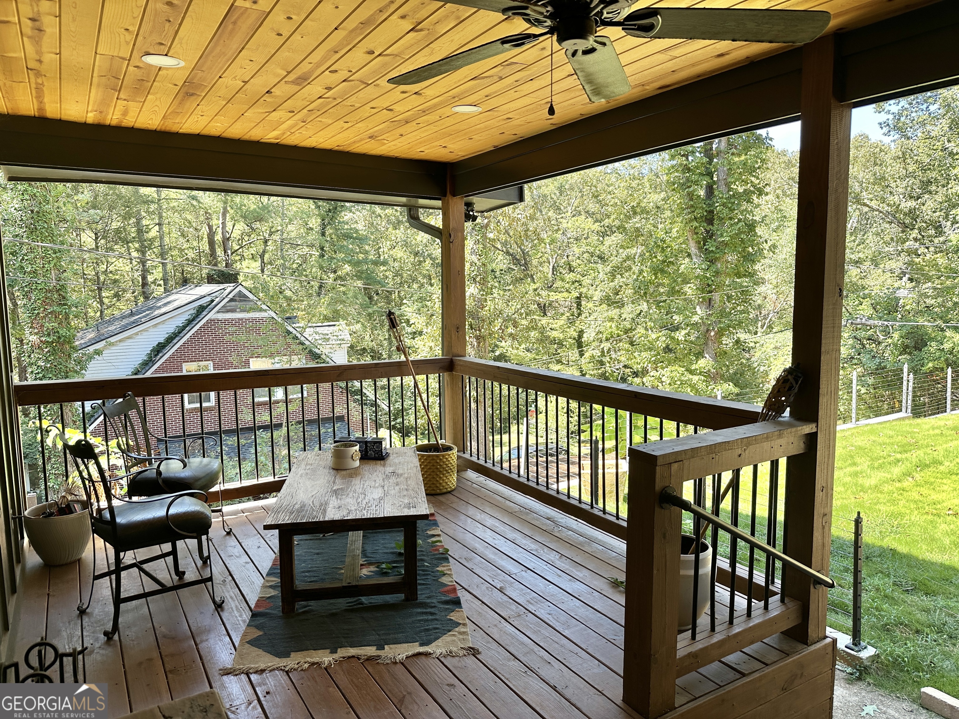 775 Ridgewood Avenue Gainesville, GA 30501 - Photo 70 of 77 a view of a balcony with chair and wooden floor