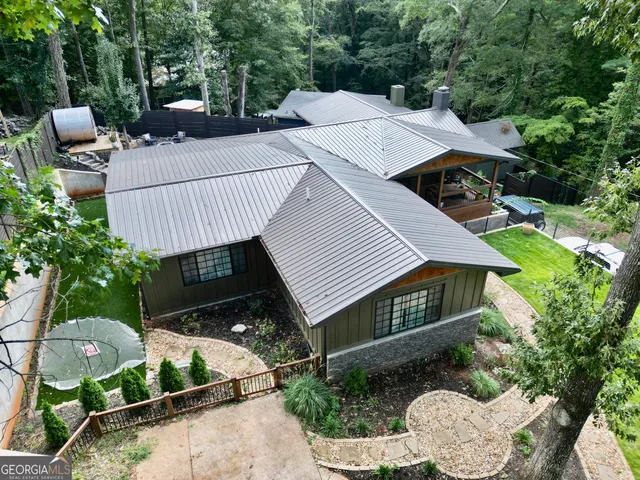 a kitchen with stainless steel appliances a stove a sink and a refrigerator