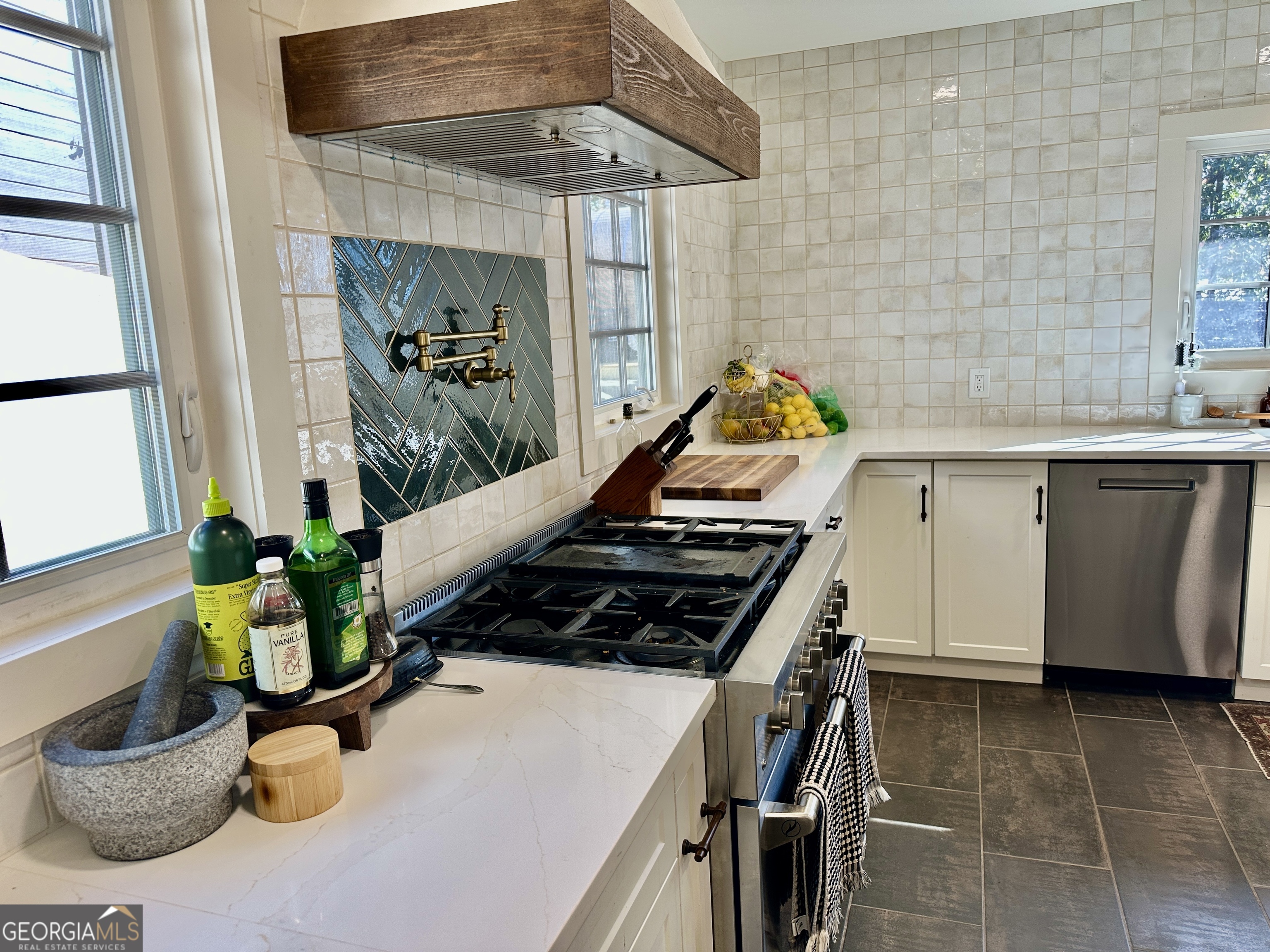 775 Ridgewood Avenue Gainesville, GA 30501 - Photo 9 of 77 a kitchen with a sink appliances and cabinets