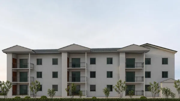 a front view of a house with glass windows