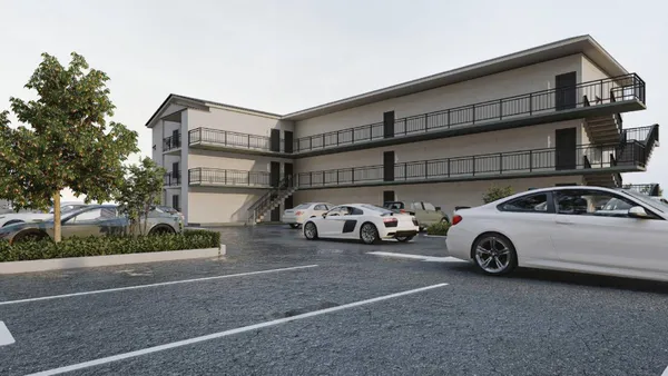 a car parked in front of a white house