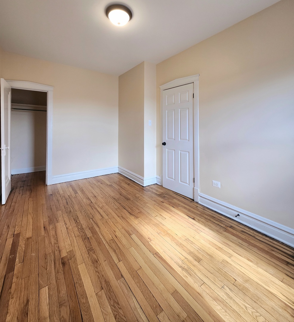 4937 West 18th Street, Unit 2W Cicero, IL 60804 - Photo 11 of 11 a view of empty room with wooden floor