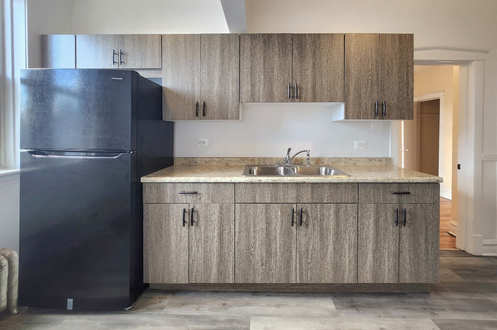 4937 West 18th Street, Unit 2W Cicero, IL 60804 - Photo 3 of 11 a kitchen with a refrigerator and cabinets