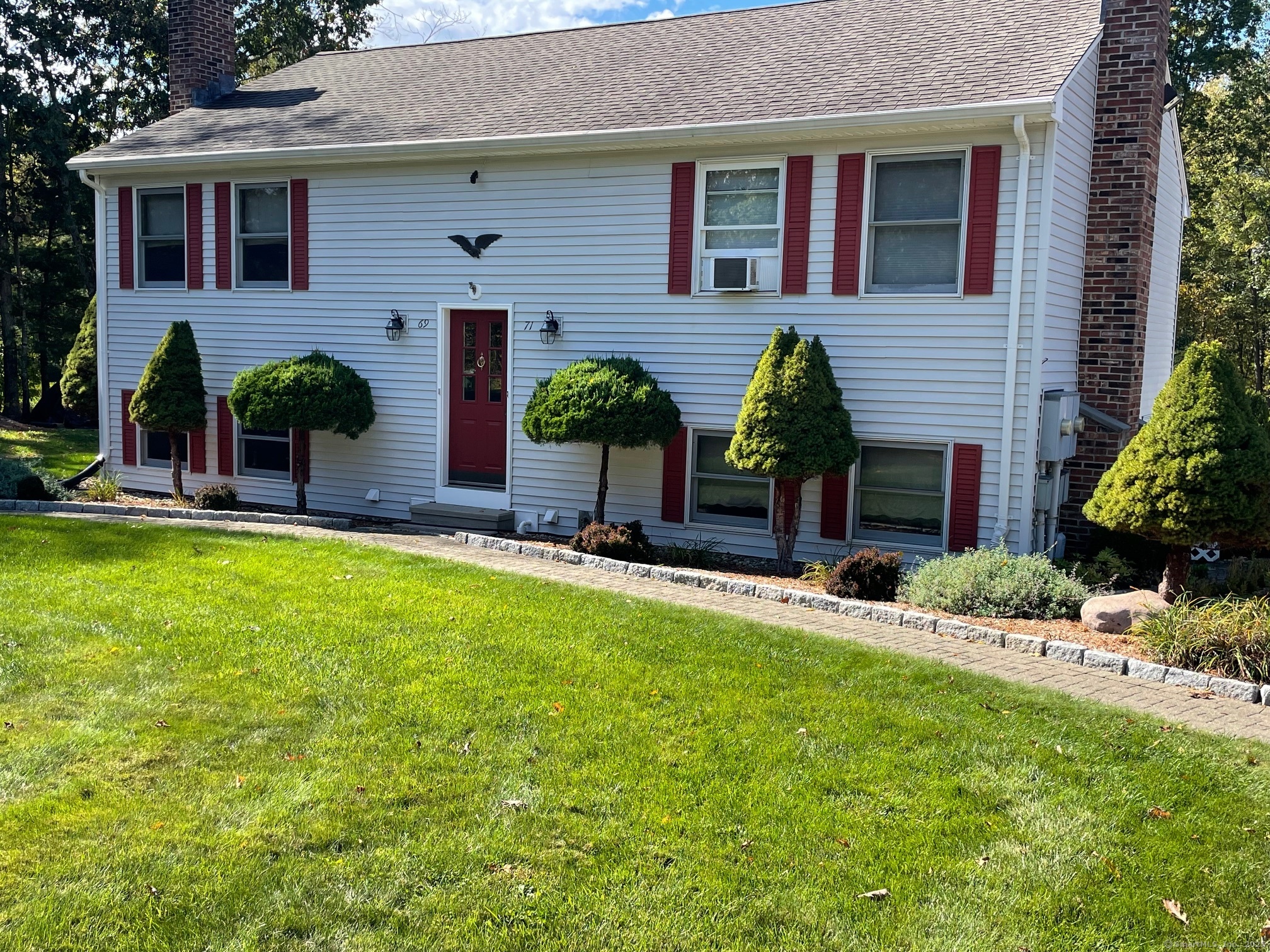 a house view with a garden space