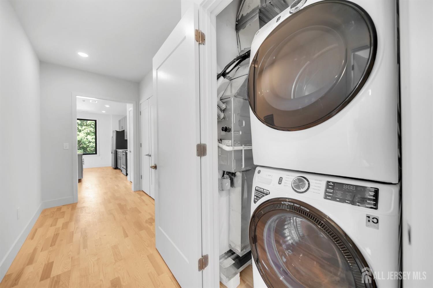 1037 Amboy Avenue Edison, NJ 08837 - Photo 5 of 5 a view of a hallway with washer and dryer