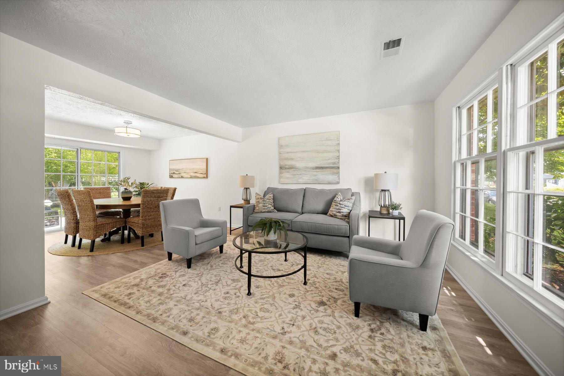 6819 Ben Franklin Road Springfield, VA 22150 - Photo 21 of 47 a living room with furniture and a large window