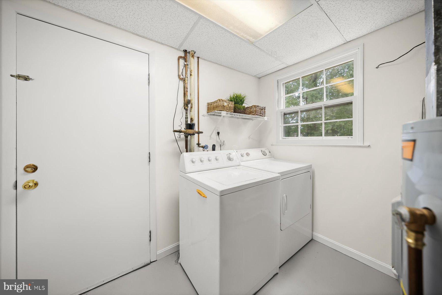 6819 Ben Franklin Road Springfield, VA 22150 - Photo 38 of 47 a utility room with dryer and washer