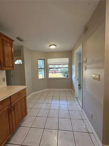 a kitchen with a sink cabinets and window