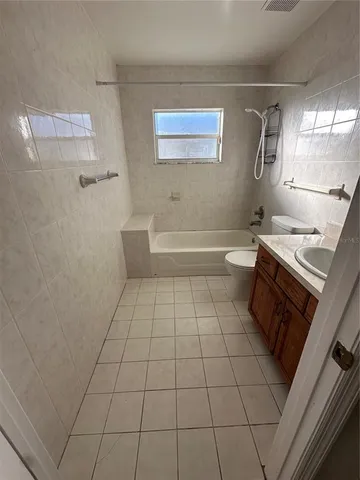 a bathroom with a bathtub and a sink