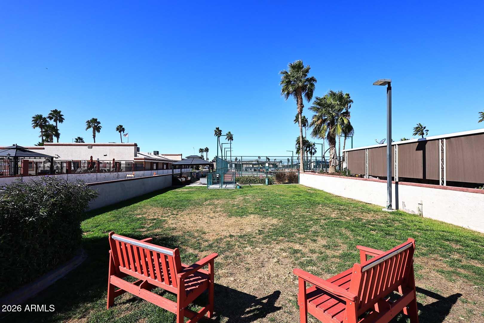 9302 East Broadway Road, Unit 76 Mesa, AZ 85208 - Photo 22 of 38 a view of a backyard with sitting area