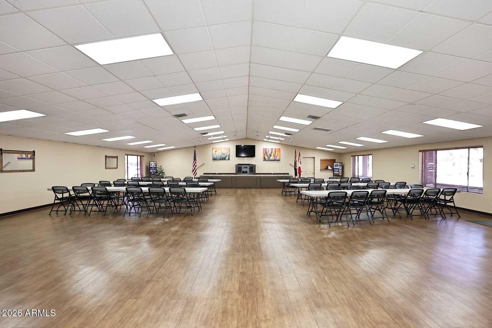 9302 East Broadway Road, Unit 76 Mesa, AZ 85208 - Photo 24 of 38 a view of a room with lots of chairs and couches with wooden floor